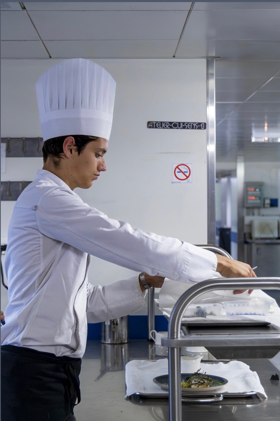 Male chef posing with hands crossed